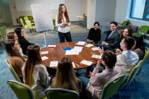 business conference or meeting at the hotel the girl on the flipchart shows the development plan